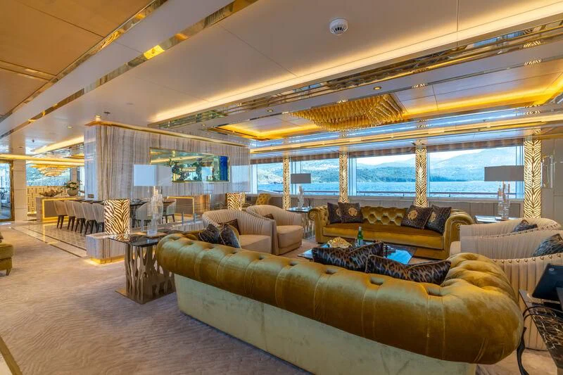 a living room with a large window aboard LEONA Yacht for Sale