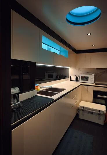 a kitchen with a blue ceiling aboard AZIMUT GRANDE 27/16 Yacht for Sale