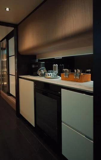 a kitchen with a black counter aboard AZIMUT GRANDE 27/16 Yacht for Sale