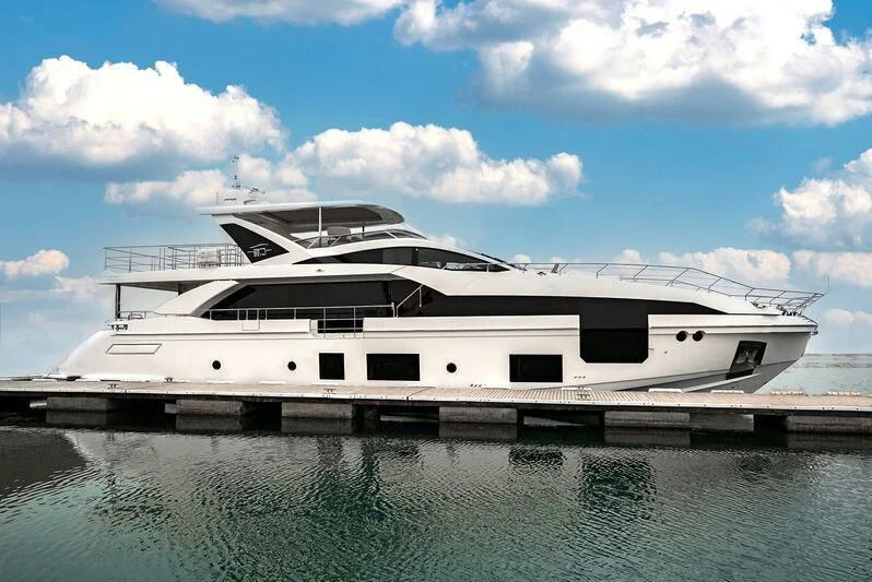a white yacht on the water aboard AZIMUT GRANDE 27/16 Yacht for Sale