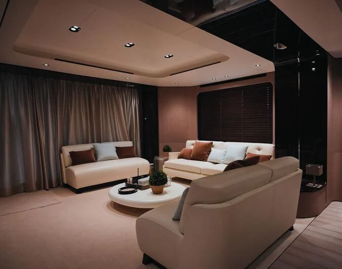 a living room with a couch and a table aboard AZIMUT GRANDE 27/16 Yacht for Sale