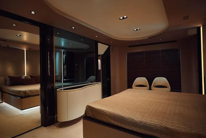 a room with a bed and a couch aboard AZIMUT GRANDE 27/16 Yacht for Sale
