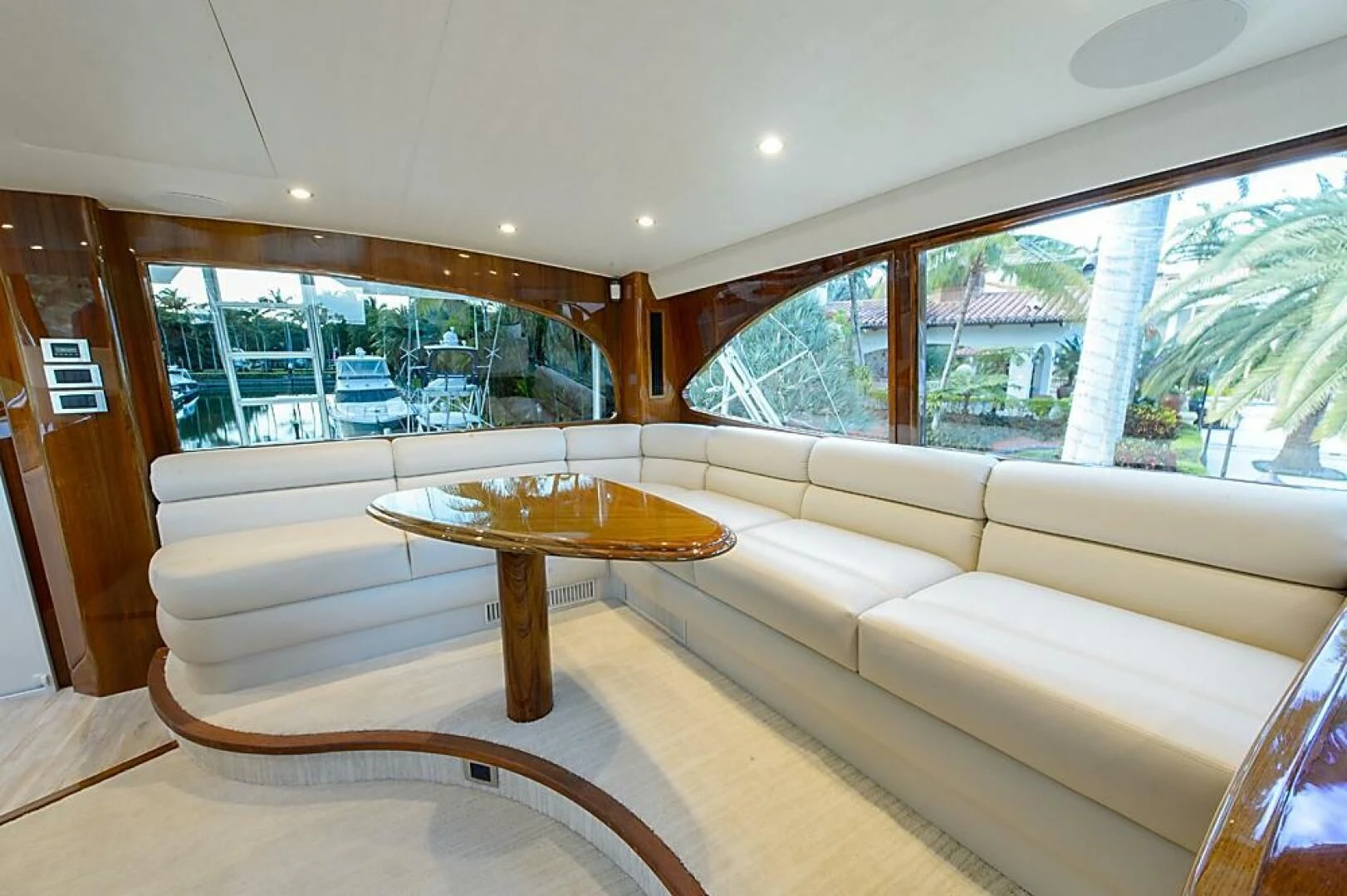 a living room with a couch and a table aboard INSTIGATOR Yacht for Sale