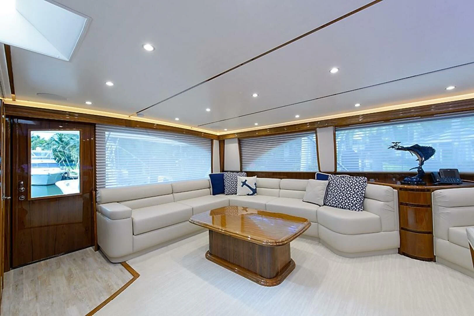 a living room with a couch and a coffee table aboard INSTIGATOR Yacht for Sale