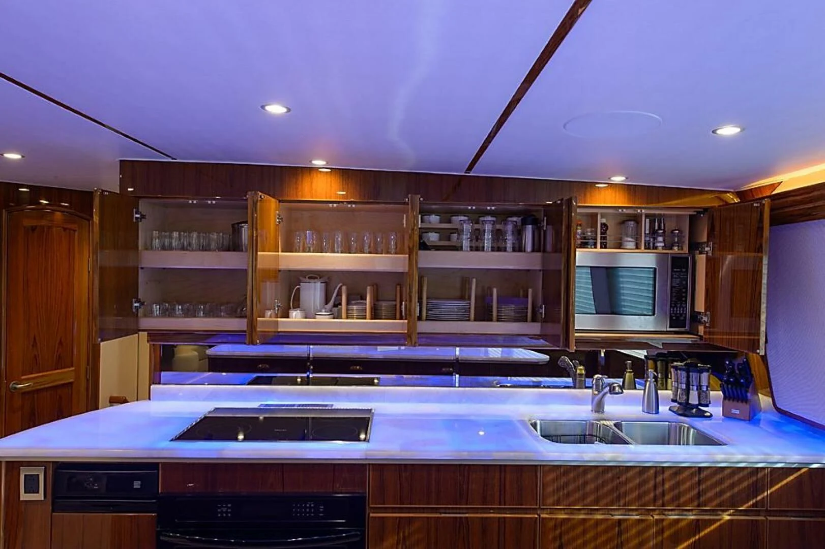 a kitchen with a large island aboard INSTIGATOR Yacht for Sale