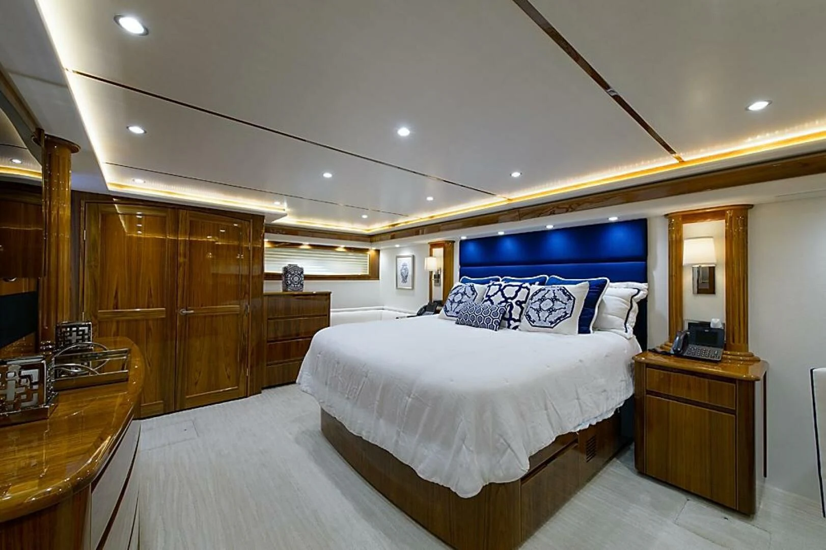 a bedroom with a bed and a desk aboard INSTIGATOR Yacht for Sale