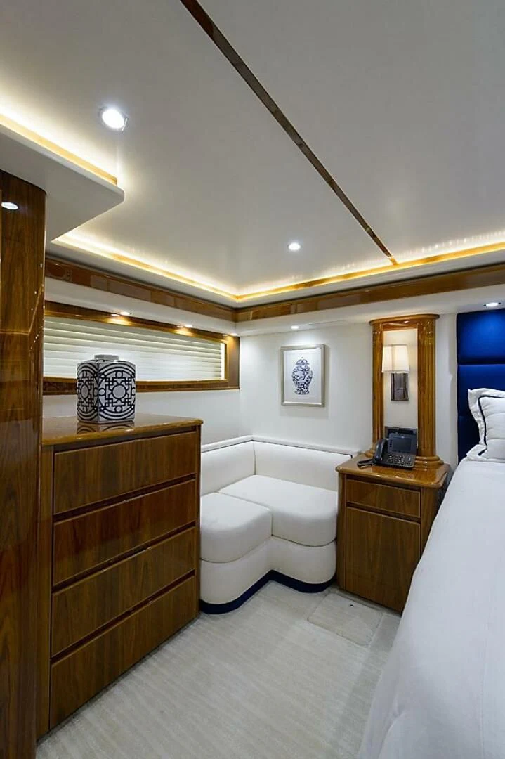 a room with a wood cabinet and a mirror aboard INSTIGATOR Yacht for Sale