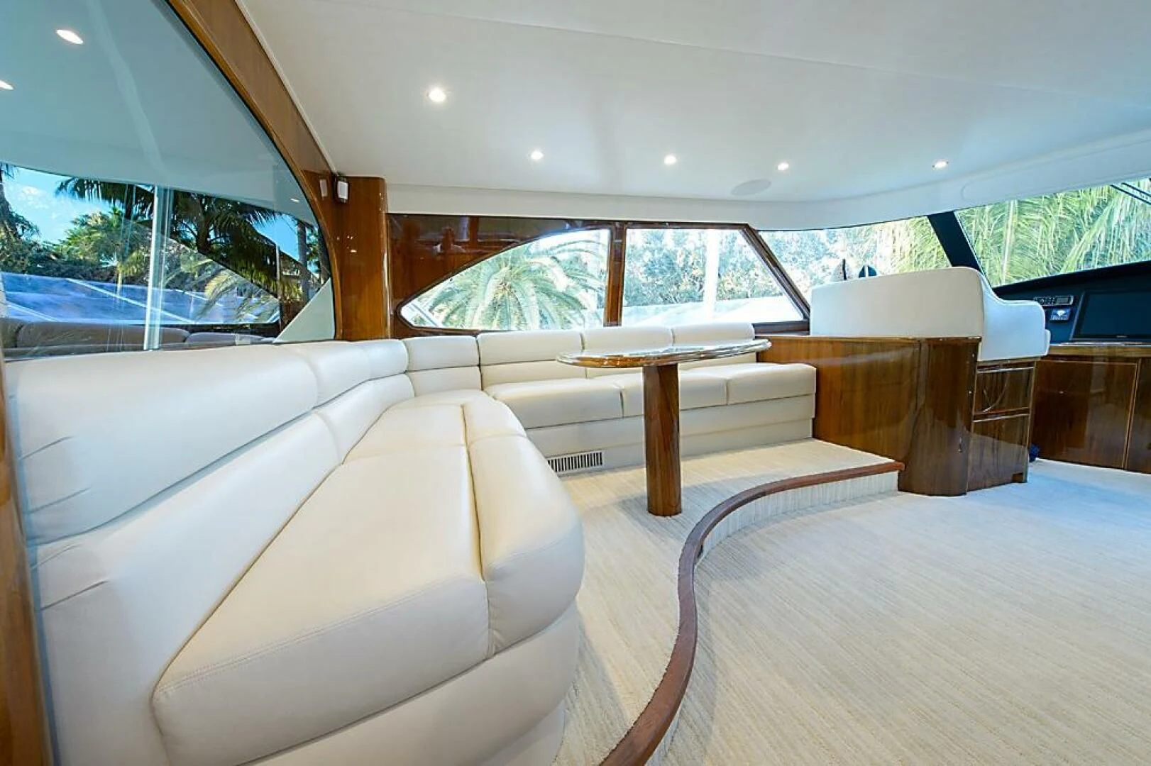 a room with a couch and a table aboard INSTIGATOR Yacht for Sale
