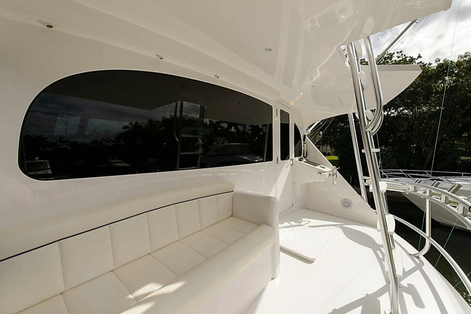 a white car with a large window aboard INSTIGATOR Yacht for Sale