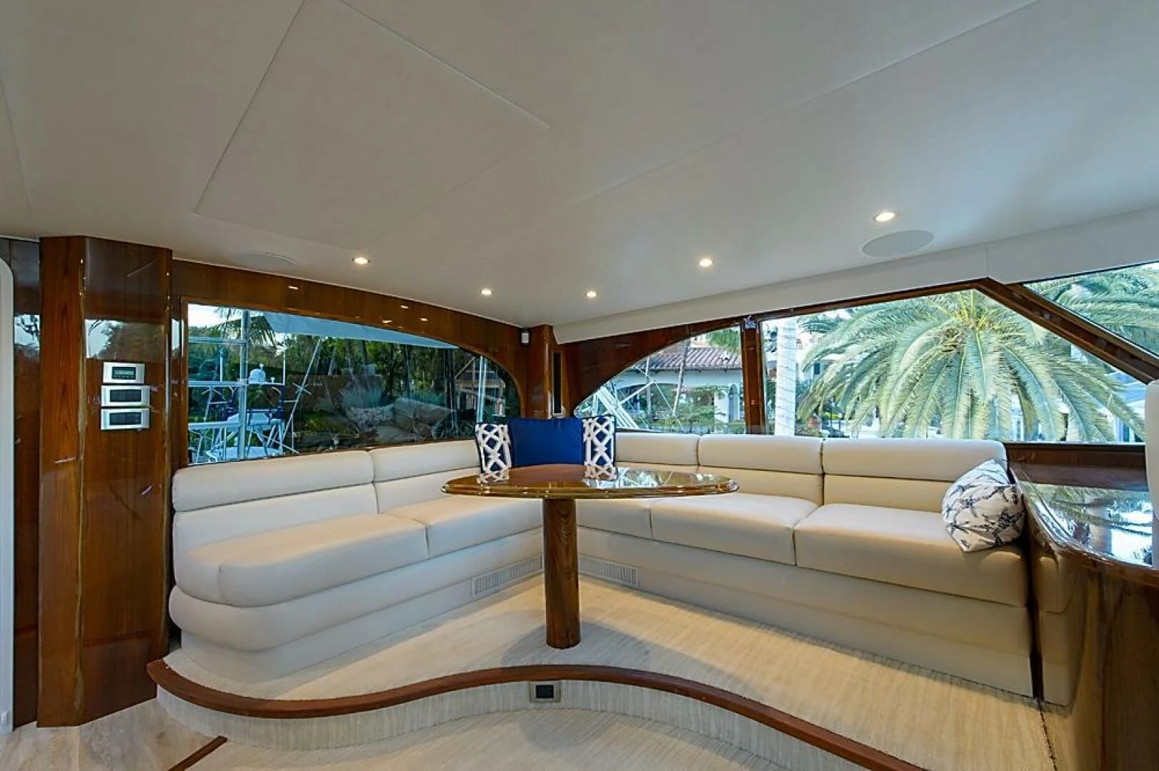 a room with a bed and a table aboard INSTIGATOR Yacht for Sale