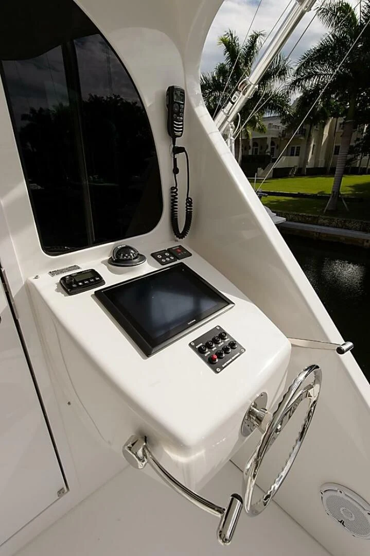 a white machine with a screen aboard INSTIGATOR Yacht for Sale