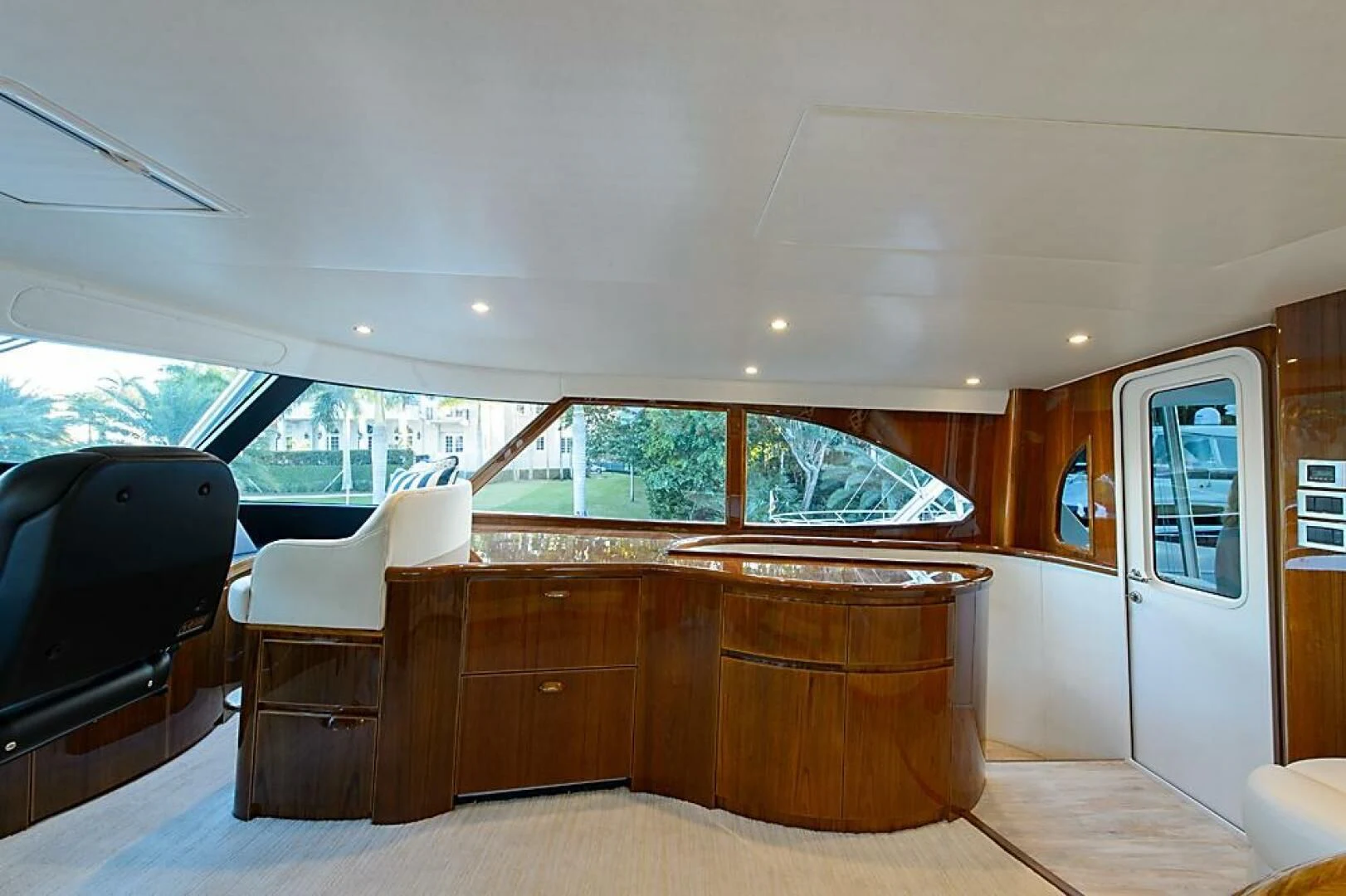 a room with a couch and a television aboard INSTIGATOR Yacht for Sale