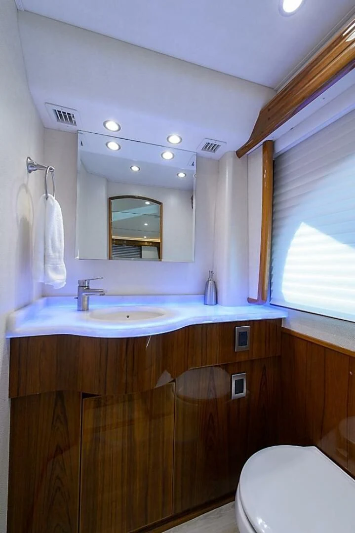 a bathroom with a sink and a toilet aboard INSTIGATOR Yacht for Sale