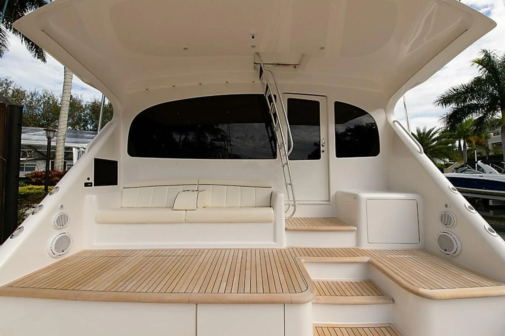a white boat on a deck aboard INSTIGATOR Yacht for Sale