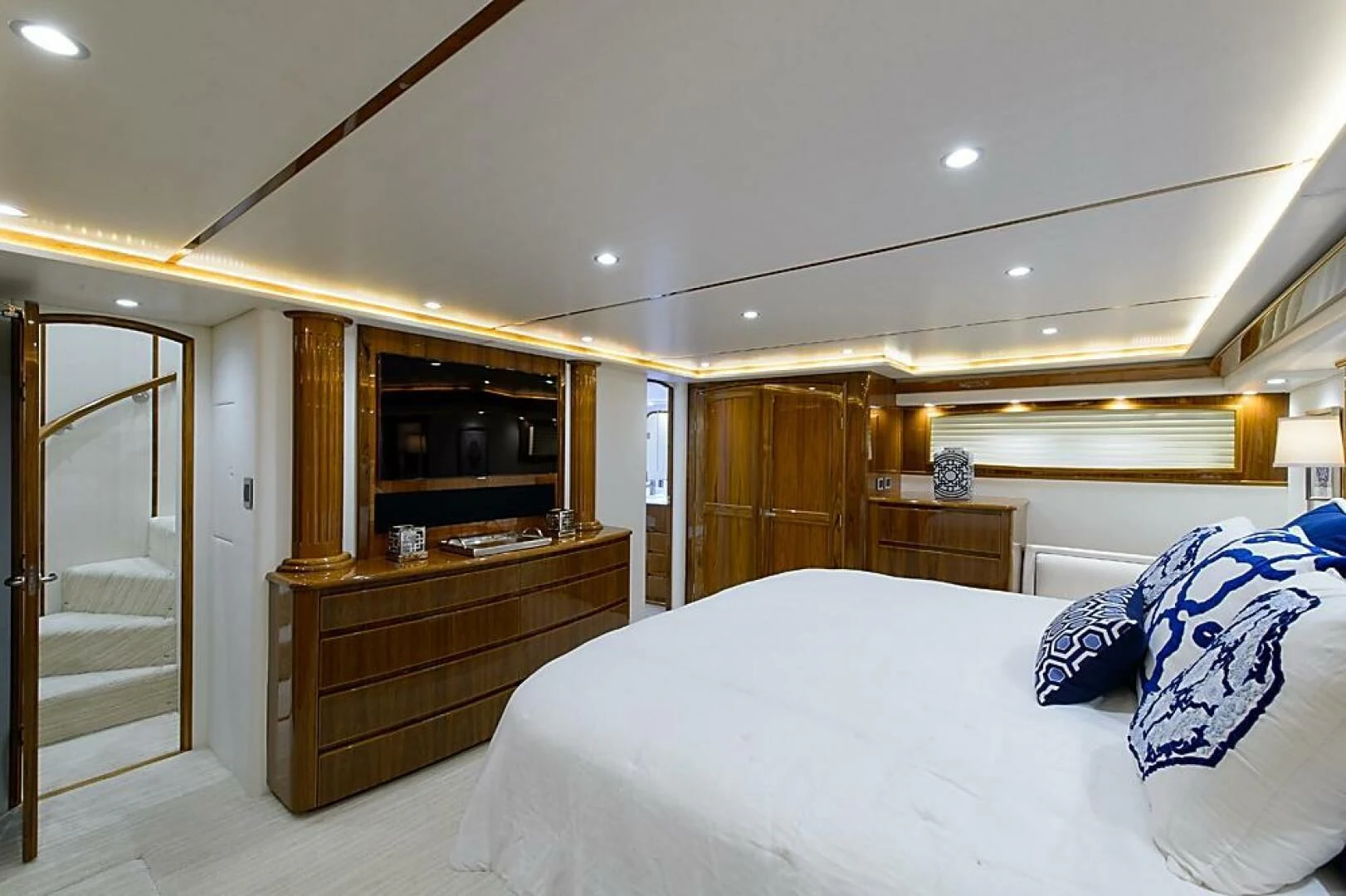 a bedroom with a large bed aboard INSTIGATOR Yacht for Sale