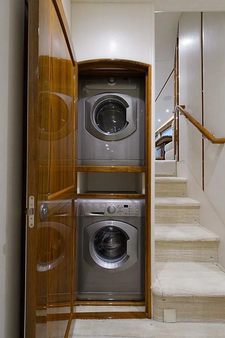 a washer and dryer in a room aboard INSTIGATOR Yacht for Sale