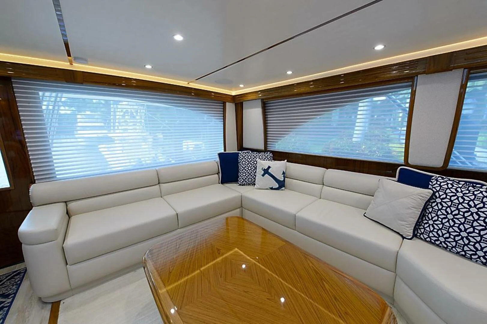 a living room with a large window aboard INSTIGATOR Yacht for Sale