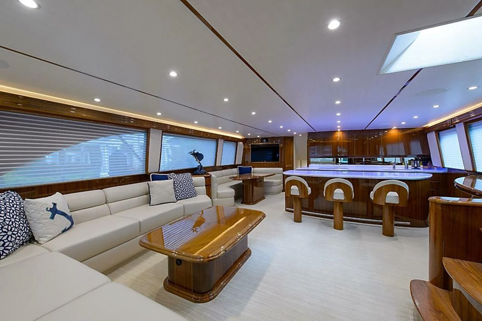 a large living room with a large window aboard INSTIGATOR Yacht for Sale