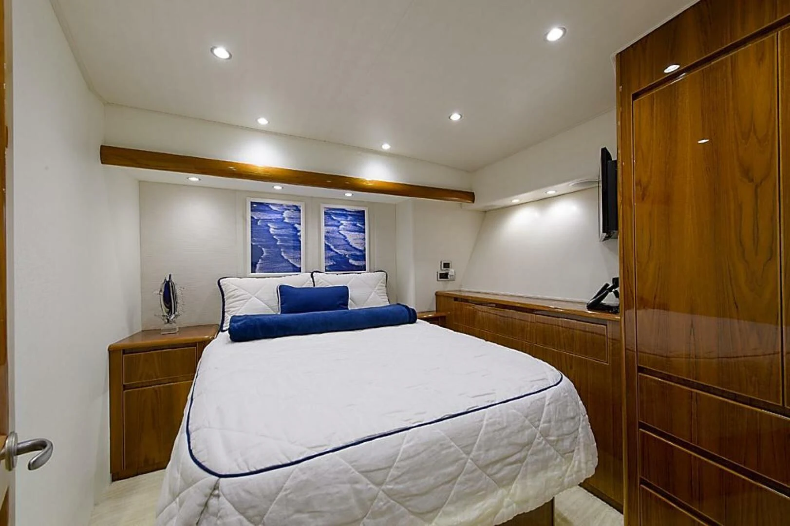 a bed in a room aboard INSTIGATOR Yacht for Sale
