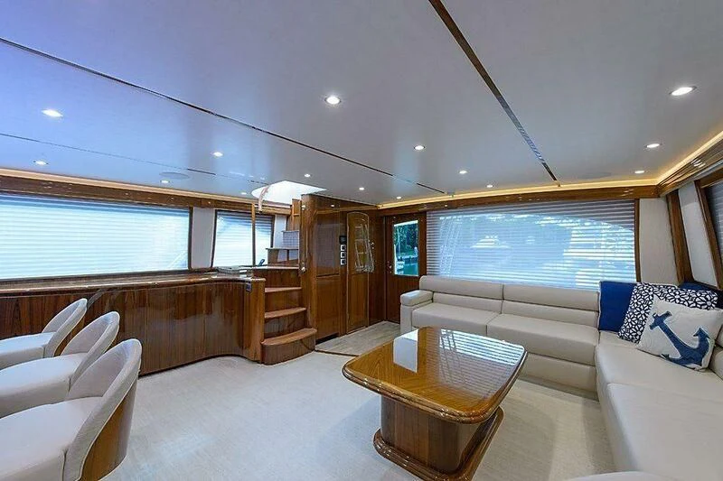a living room with a large window aboard INSTIGATOR Yacht for Sale