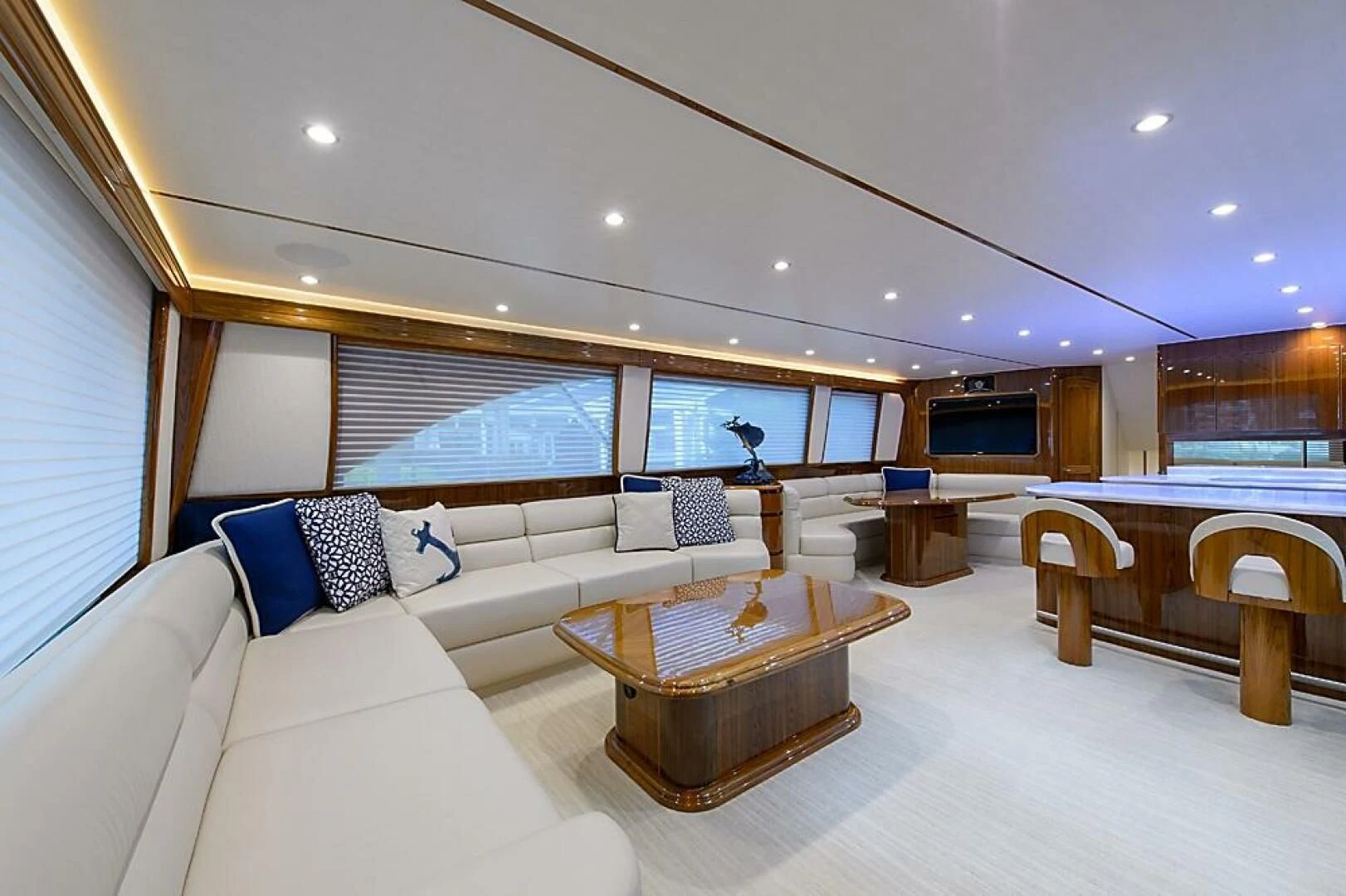 a living room with a large window aboard INSTIGATOR Yacht for Sale