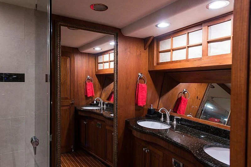 a bathroom with a large mirror aboard CASABELLA Yacht for Sale