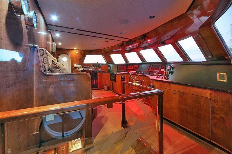 a large room with wooden tables aboard CASABELLA Yacht for Sale