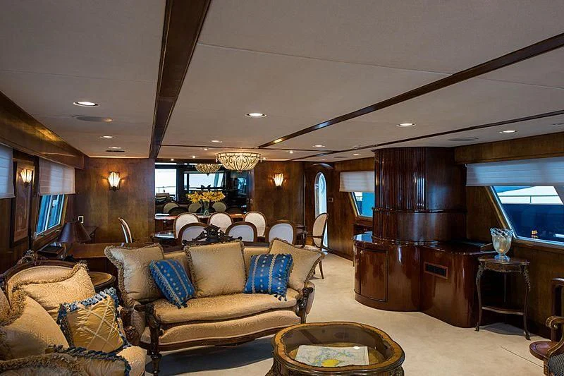 a living room with a couch and a table aboard CASABELLA Yacht for Sale