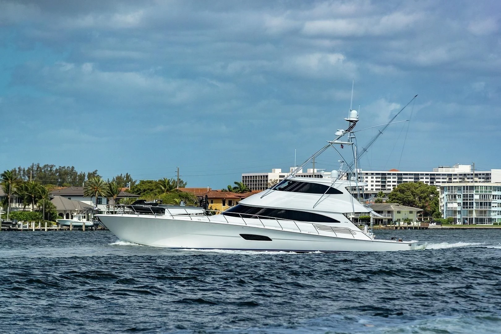a white boat on the water aboard AUSSIE RULES Yacht for Sale