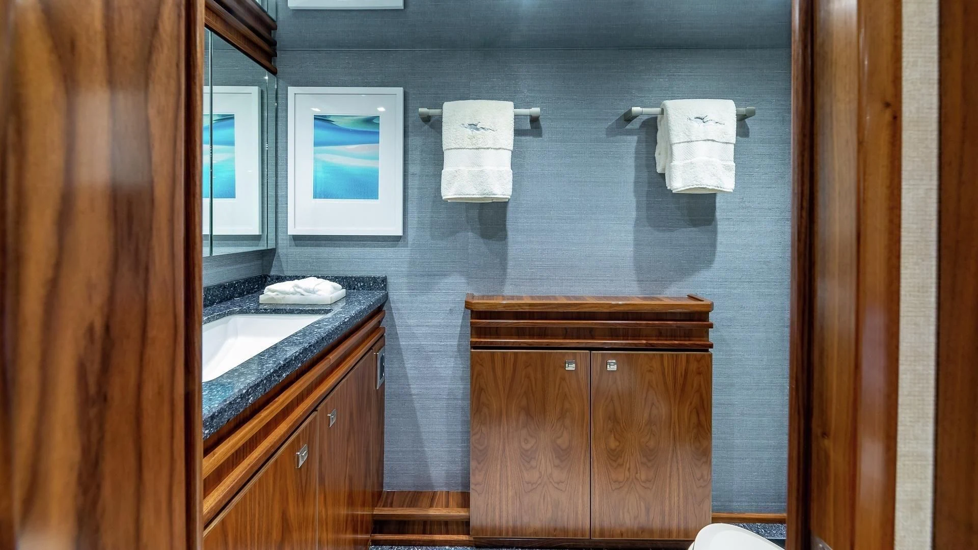 a bathroom with a sink and a mirror aboard AUSSIE RULES Yacht for Sale