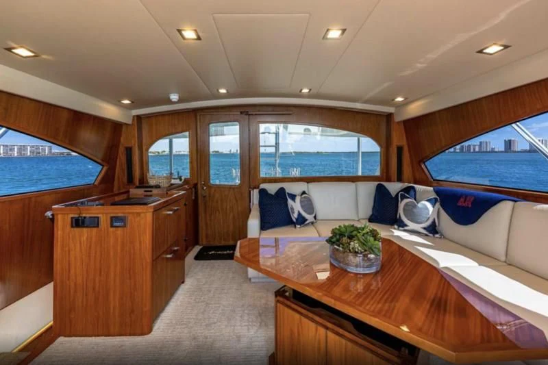 a living room with a large window aboard AUSSIE RULES Yacht for Sale