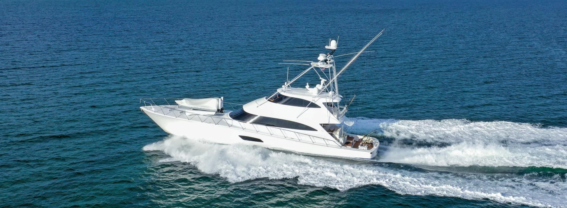 a white boat in the water aboard AUSSIE RULES Yacht for Sale