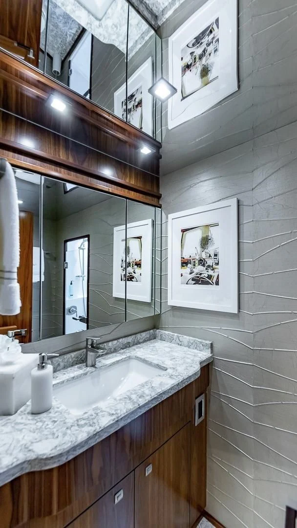 a bathroom with a large mirror aboard AUSSIE RULES Yacht for Sale