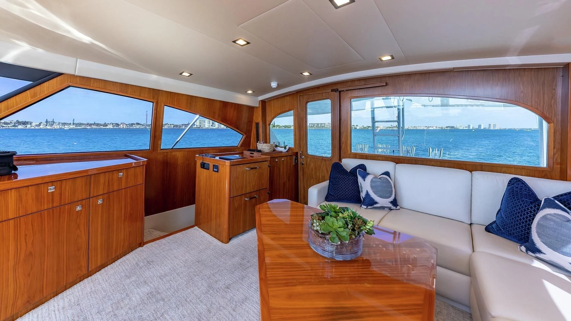 a living room with a couch and a table aboard AUSSIE RULES Yacht for Sale
