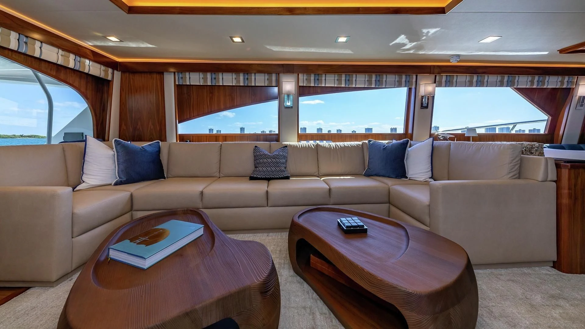 a living room with a couch and a table aboard AUSSIE RULES Yacht for Sale