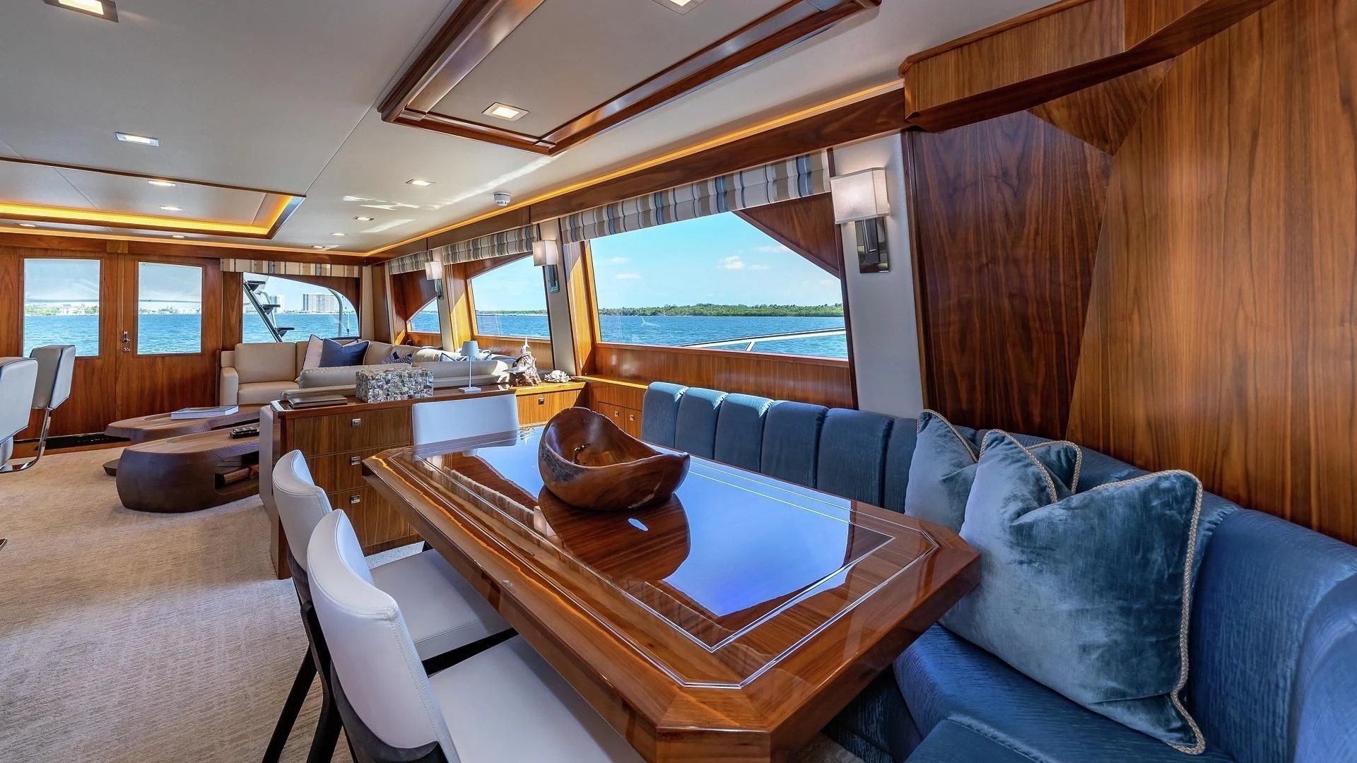 a living room with a table and chairs aboard AUSSIE RULES Yacht for Sale