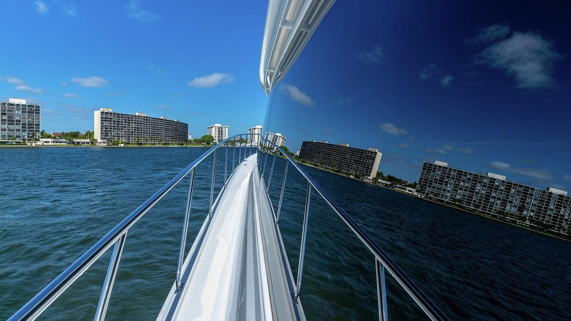 a bridge over water with buildings in the background aboard AUSSIE RULES Yacht for Sale