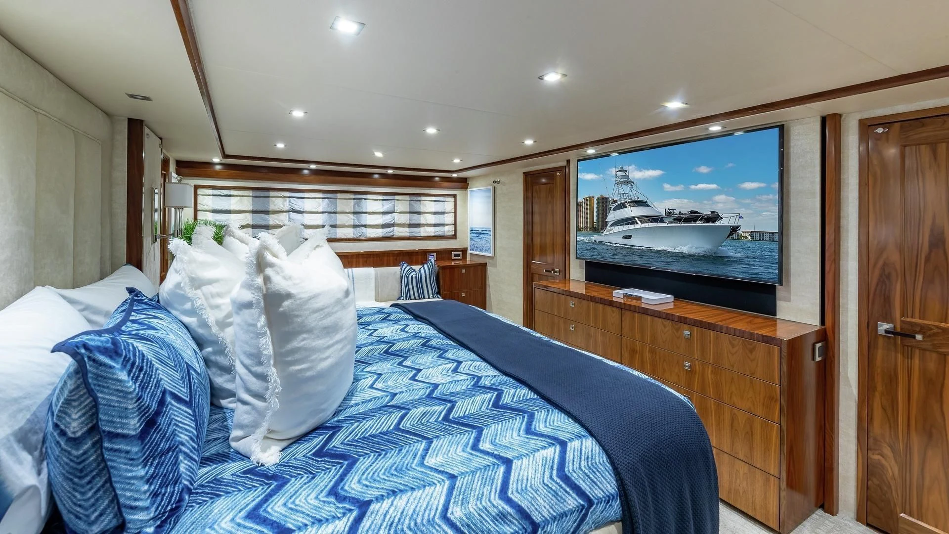 a bed with a television on the wall aboard AUSSIE RULES Yacht for Sale