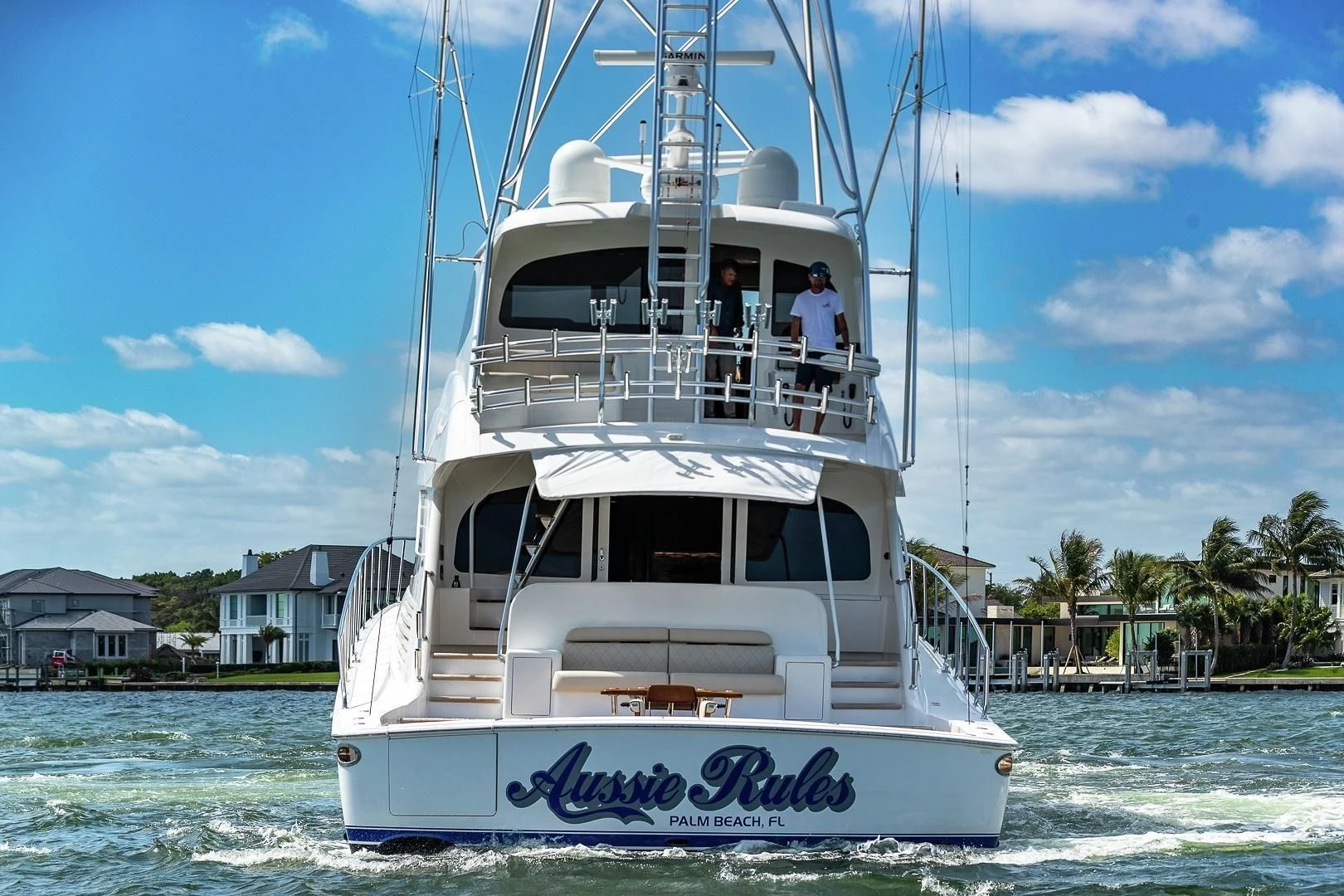a white boat with people on it aboard AUSSIE RULES Yacht for Sale