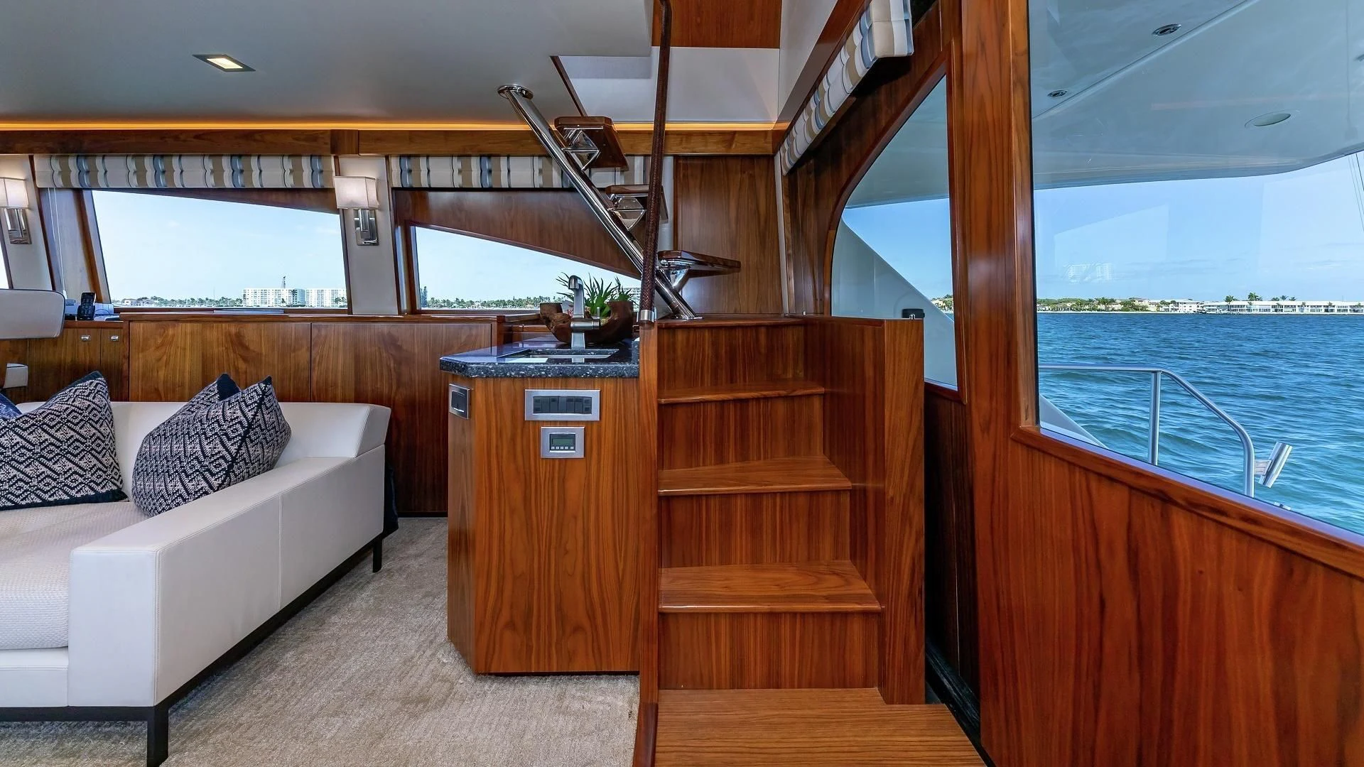 a living room with a couch and a wood table aboard AUSSIE RULES Yacht for Sale