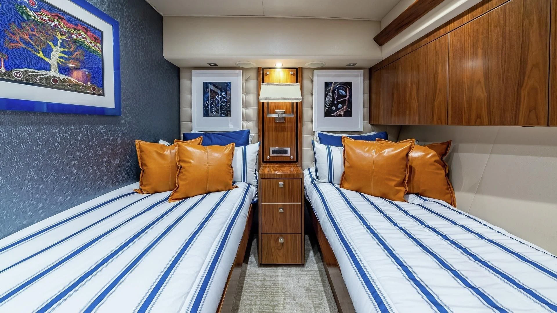 a room with a bed and a dresser aboard AUSSIE RULES Yacht for Sale