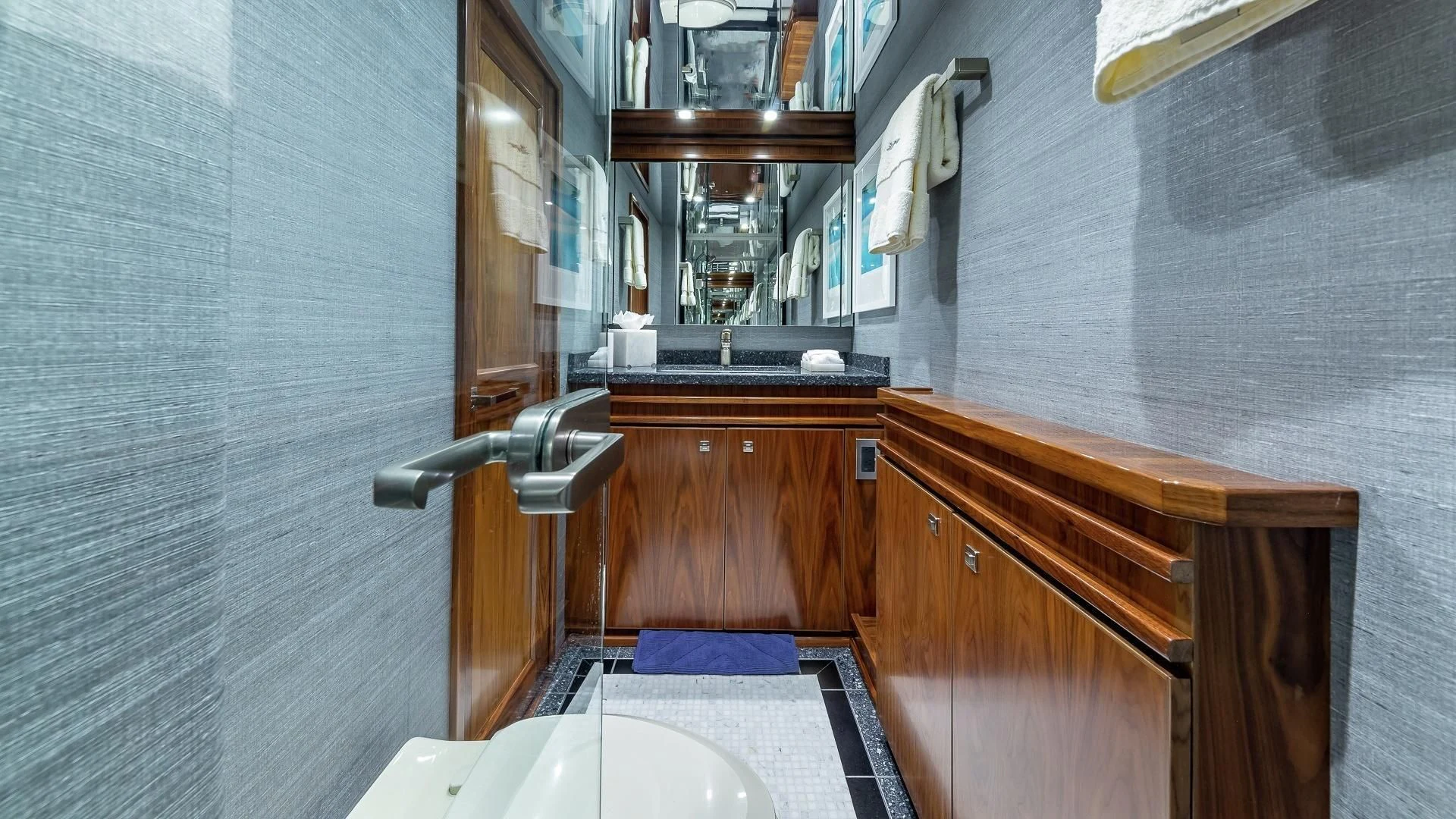 a bathroom with a sink and a mirror aboard AUSSIE RULES Yacht for Sale