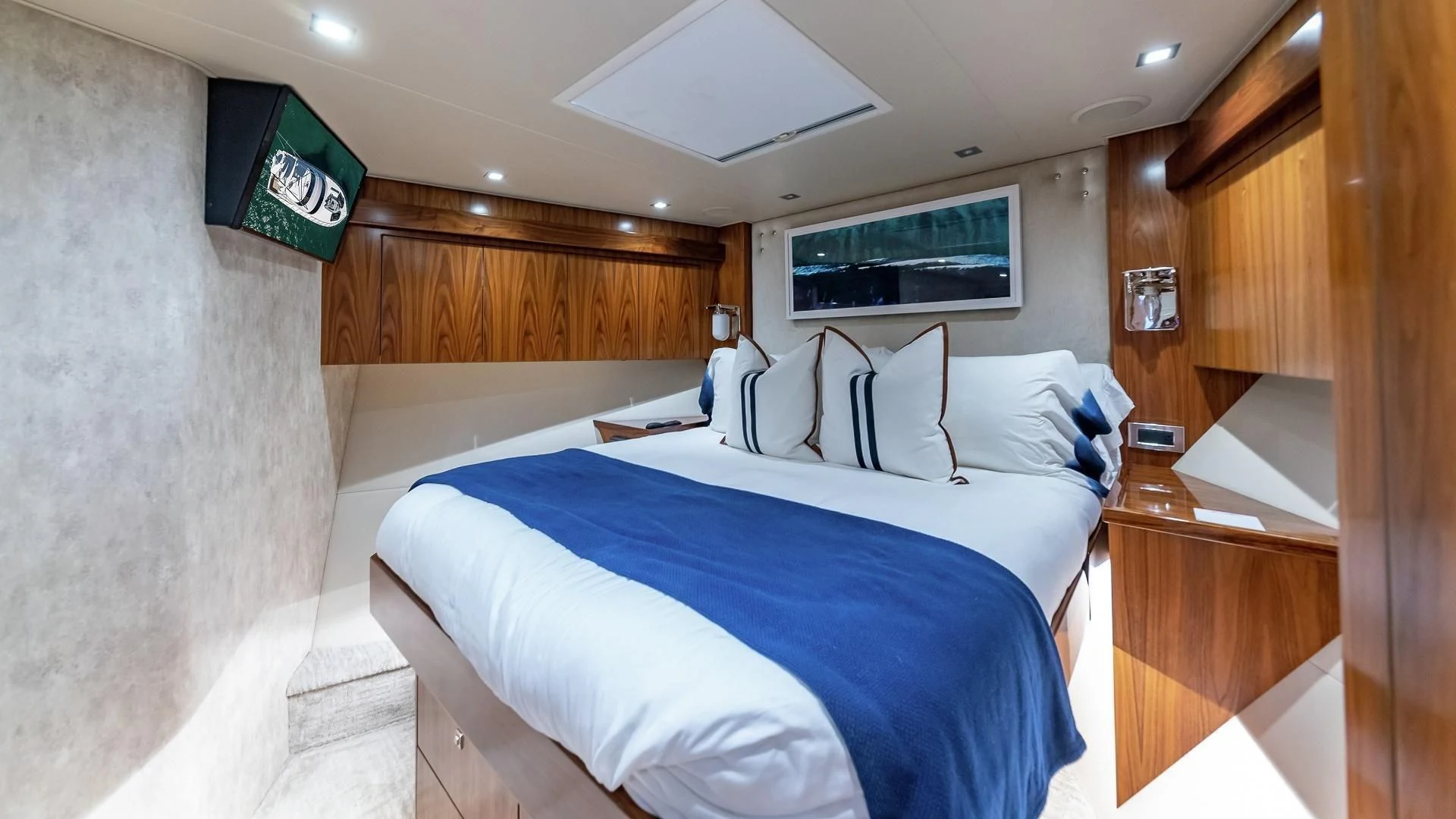 a room with a bed and a television aboard AUSSIE RULES Yacht for Sale