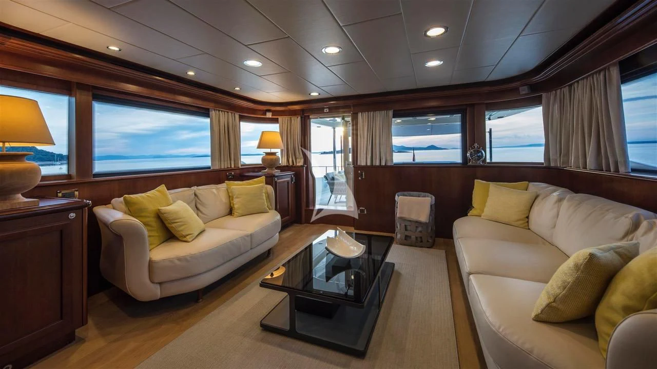 a living room with a couch and a coffee table aboard ENA Yacht for Sale