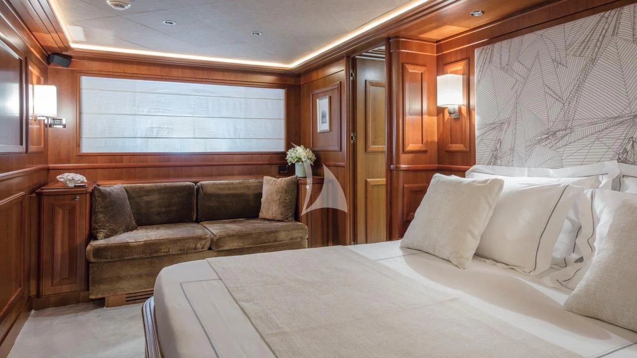 a bed and a couch in a room aboard ENA Yacht for Sale
