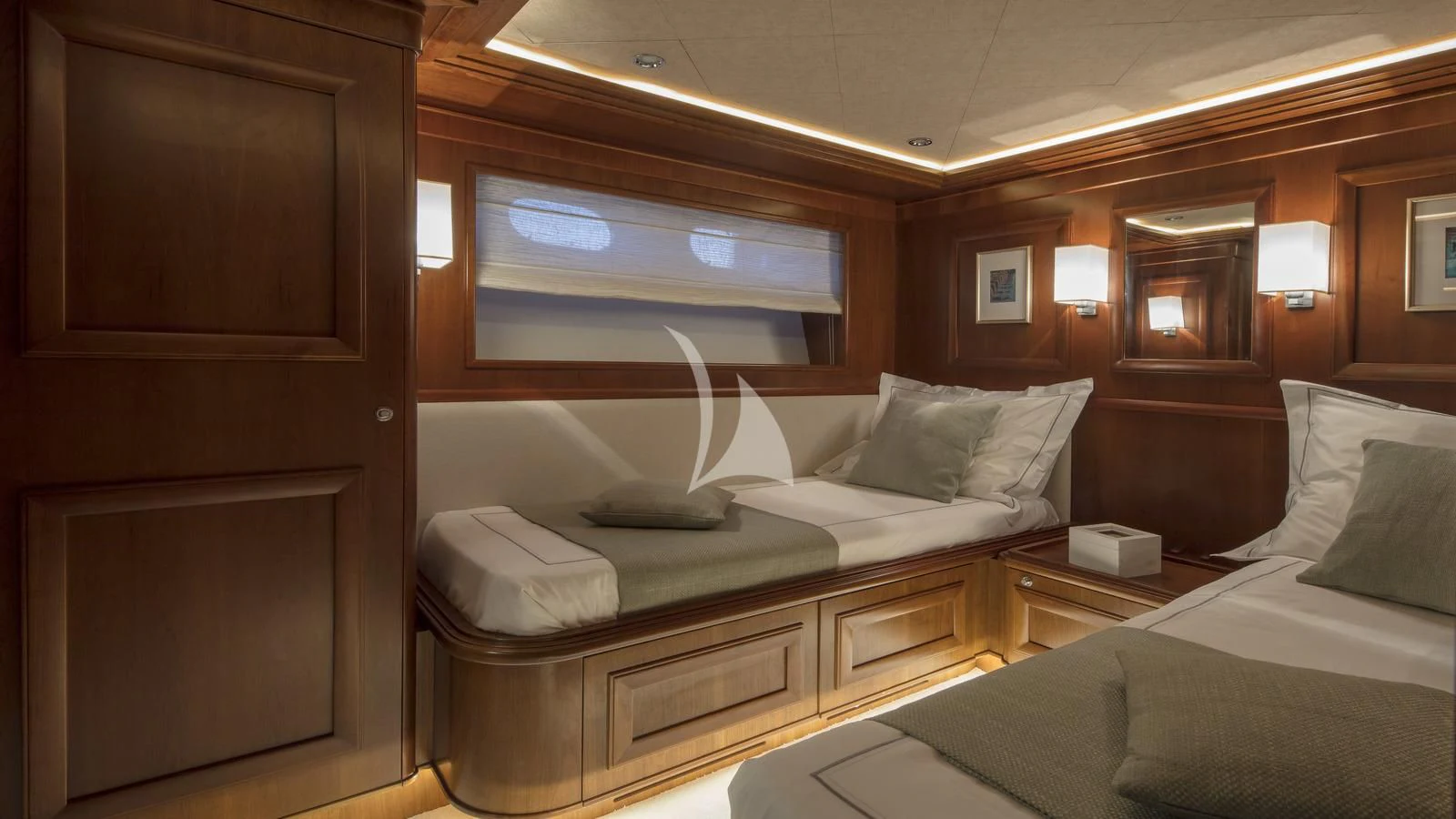 a room with a bed and a desk aboard ENA Yacht for Sale