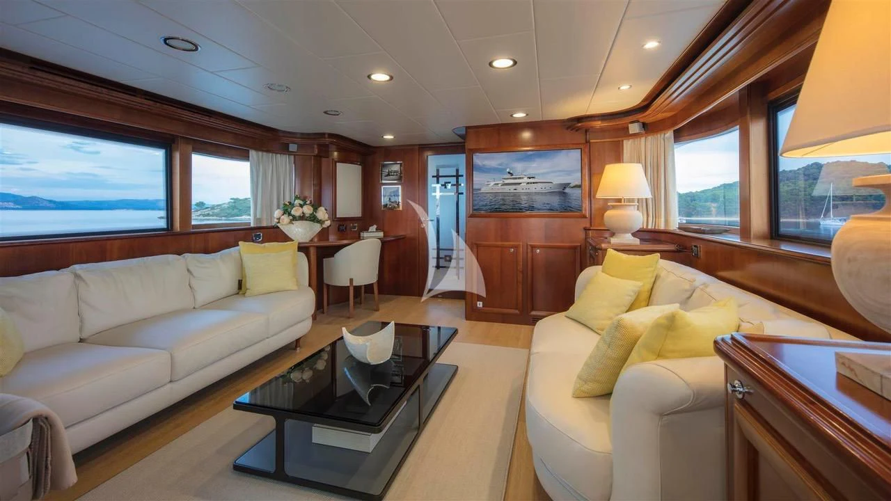 a living room with a couch and a coffee table aboard ENA Yacht for Sale