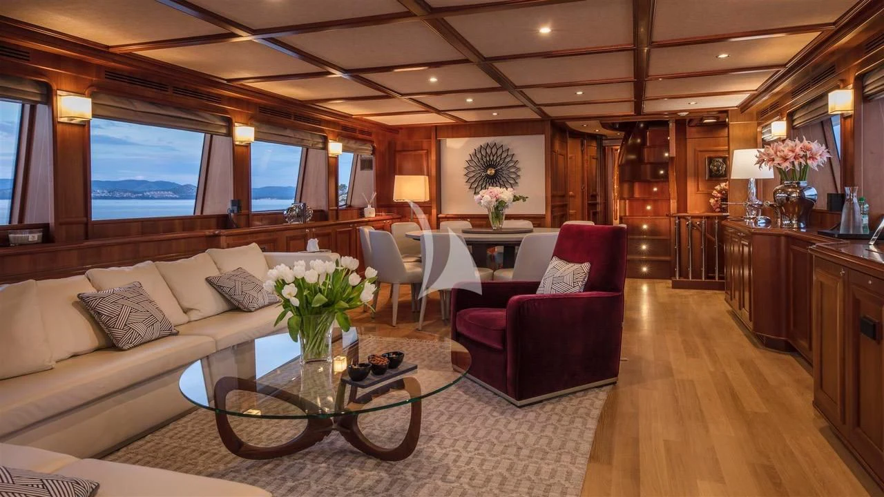 a living room with a couch and a table aboard ENA Yacht for Sale