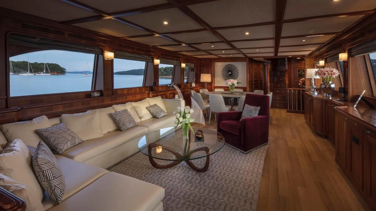 a living room with a large window aboard ENA Yacht for Sale