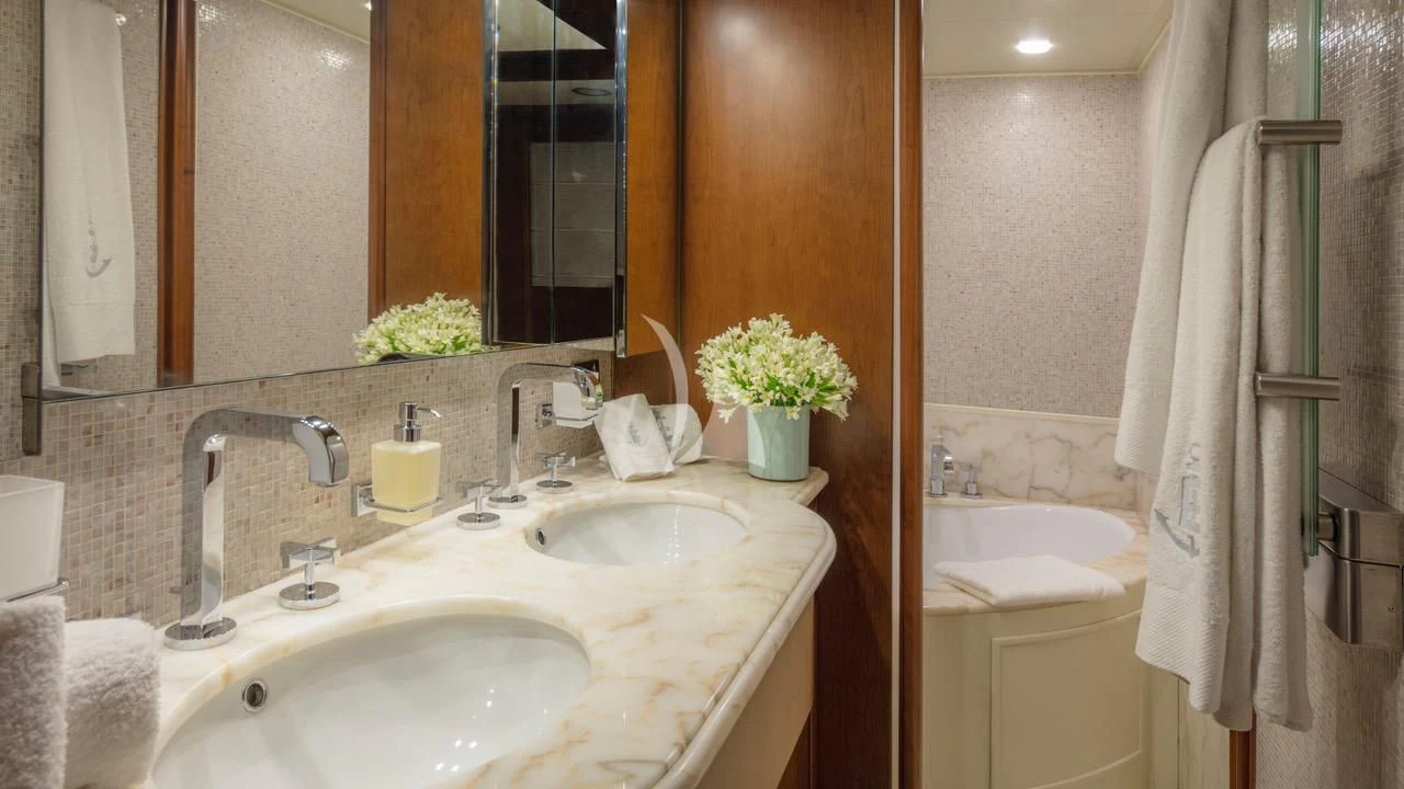 a bathroom with a sink and bathtub aboard ENA Yacht for Sale